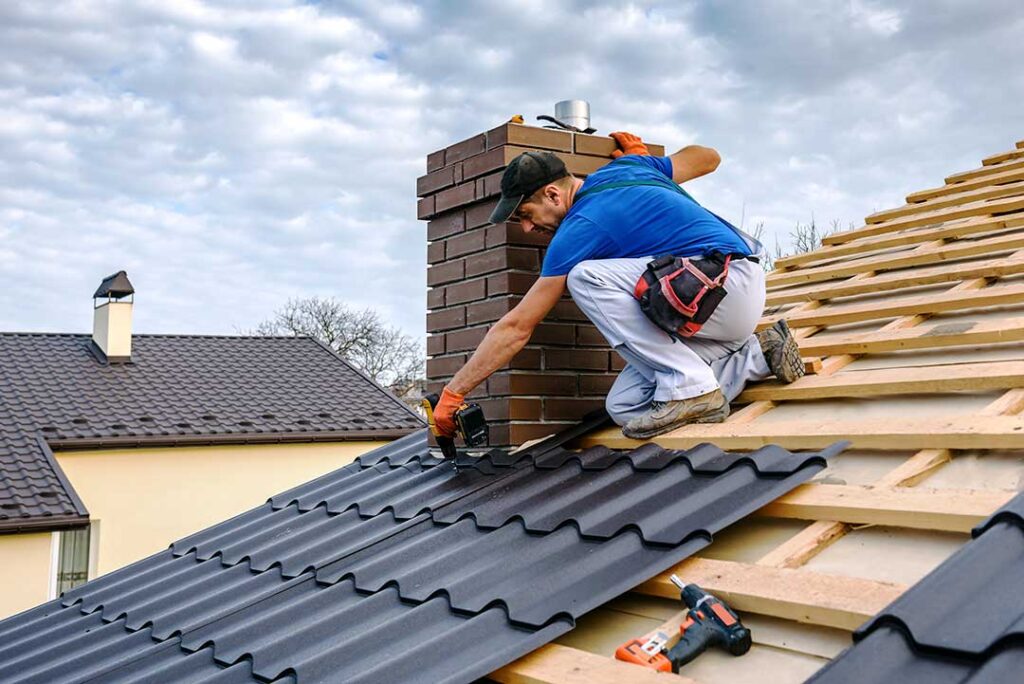 A homeowner examines soffit vents and attic insulation beneath a sloped roof.